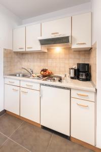 Η κουζίνα ή μικρή κουζίνα στο Appartementhaus Gaby +23 φωτογραφίες