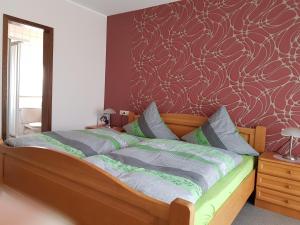 Postel nebo postele na pokoji v ubytování Gästehaus Cornelia