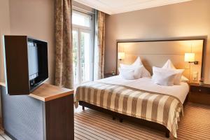 Postel nebo postele na pokoji v ubytování Steigenberger Hotel Bad Neuenahr