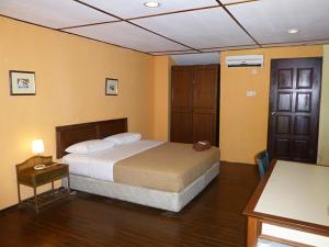 Un ou plusieurs lits dans un hébergement de l'établissement D'coconut Island Resort