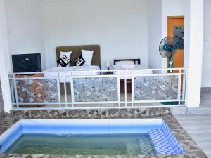 a room with a swimming pool in the middle of a room at Ornateview Hotel in Ella