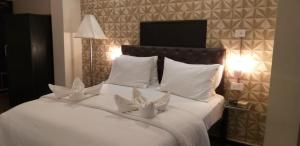 Postel nebo postele na pokoji v ubytování Creek Hotel - Panaji