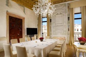a large dining room with a long table and chairs at Hotel Palazzo Giovanelli e Gran Canal in Venice