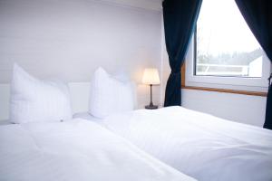 En eller flere senge i et værelse på Welcome in - Appartement met dakterras nabij skipiste + 32 billeder