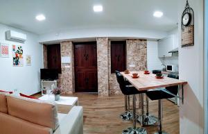 TV a/nebo společenská místnost v ubytování Loft Azahar junto a Puente Romano