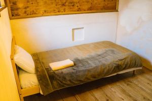 Postel nebo postele na pokoji v ubytování Onsen Guesthouse HAKONE TENT