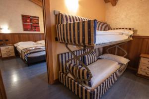 Postel nebo postele na pokoji v ubytování Hotel Bernina