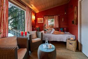 a woman is sitting on a bed in a room at Appartamenti La Sajun & Les Viles in La Villa +63 photos
