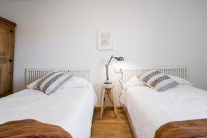 Postel nebo postele na pokoji v ubytování Apartamento Ático Bardenas