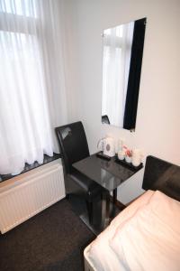 Postel nebo postele na pokoji v ubytování Hotel Bienvenue