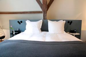 Postel nebo postele na pokoji v ubytování Hotel Julien