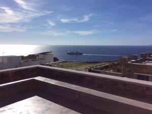 a view of the ocean from a building at Carmela in Kionia