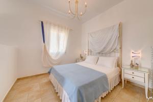 Кровать или кровати в номере Opalio Apartments