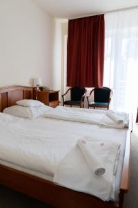 Postel nebo postele na pokoji v ubytování Well Hotel