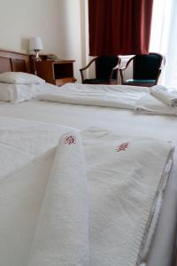 Postel nebo postele na pokoji v ubytování Well Hotel