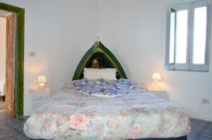 Katil atau katil-katil dalam bilik di Appartamento Zeus