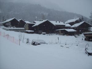 a group of houses covered in snow at Pensione Genzianella in Alagna Valsesia