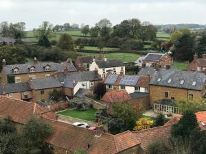an aerial view of a village with roofs at The Kings Arms (Scalford) in Melton Mowbray