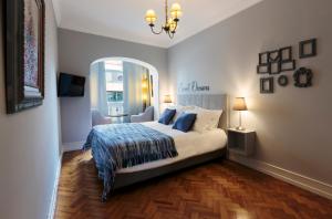 a bedroom with a bed and a large mirror at My Saldanha Suites in Lisbon