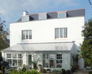 a white house with a roof at The Chantry in Callington