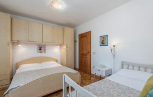 Postel nebo postele na pokoji v ubytování Apartment Complex Orzan Lovrecica