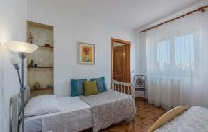Postel nebo postele na pokoji v ubytování Apartment Complex Orzan Lovrecica