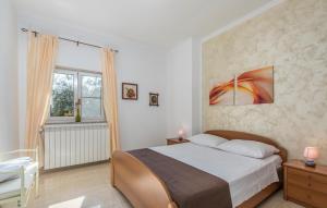 Postel nebo postele na pokoji v ubytování Apartment Complex Orzan Lovrecica
