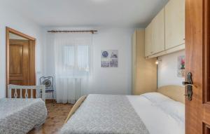 Postel nebo postele na pokoji v ubytování Apartment Complex Orzan Lovrecica