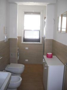 Ванная комната в Villa Punta Piccola sul mare