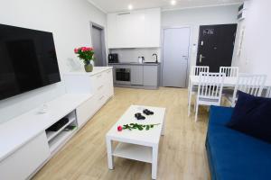 Kuchyňa alebo kuchynka v ubytovaní Apartamenty Chwytowo 14 + 12 fotografií