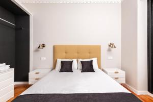 Кровать или кровати в номере Gran via Excellent, by Presidence Rentals