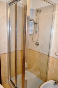 a bathroom with a shower and a sink at Casa Bianca Del Centro in San Vito lo Capo