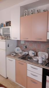 A kitchen or kitchenette at MIO & TUYO CASE VACANZE