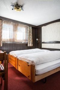 Postel nebo postele na pokoji v ubytování Hotel Burgener