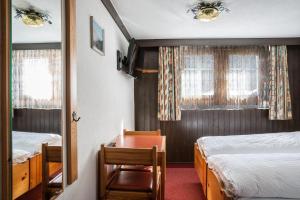 Postel nebo postele na pokoji v ubytování Hotel Burgener