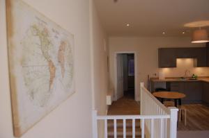 a map of the world hanging on a wall in a kitchen at 3C Endless Street in Salisbury