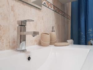 Koupelna v ubytování Apartamento Monte Gordo + 28 fotografií