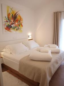 A bed or beds in a room at Holiday Hvar