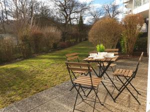 a table and chairs sitting on a patio at Wohlfühl-Apartment Bad Kissingen I in Bad Kissingen