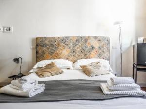 Posteľ alebo postele v izbe v ubytovaní Mecenate Rooms