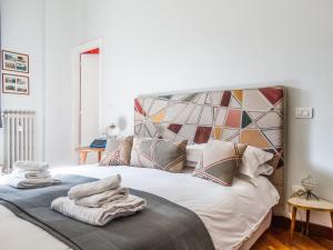 Posteľ alebo postele v izbe v ubytovaní Mecenate Rooms