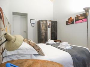 Posteľ alebo postele v izbe v ubytovaní Mecenate Rooms
