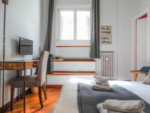 Posteľ alebo postele v izbe v ubytovaní Mecenate Rooms