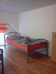 a bedroom with a bed in a room with a staircase at Apartment Jannowitzbrücke in Berlin