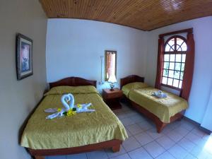 Voodi või voodid majutusasutuse Hotel Los Higuerones toas