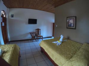 Voodi või voodid majutusasutuse Hotel Los Higuerones toas