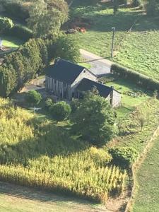an aerial view of a house in a field at Côté Campagne in Durbuy
