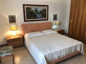 Postel nebo postele na pokoji v ubytování Locazione Turistica F.G. Rando