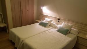 Posteľ alebo postele v izbe v ubytovaní Hotel Aguadoce - Louzao