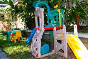 a set of playground equipment in a yard at Las Magnolias Hotel Boutique in San Salvador